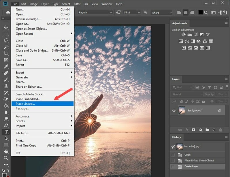 Bước 2: Mở Adobe Photoshop trên máy tính của bạn. Chọn "File" trong thanh menu và chọn "Open" để mở ảnh mà bạn muốn chèn logo. Tiếp đến nhẫn vào menu File >  Place Linked… > Chọn đến file logo > Bấm Place.