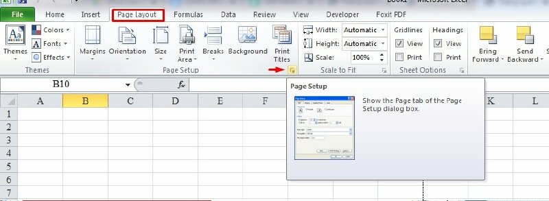 Bước 2: Chọn tab Page Layout > Bấm vào biểu tượng mũi tên nhỏ ở Page Setup.
